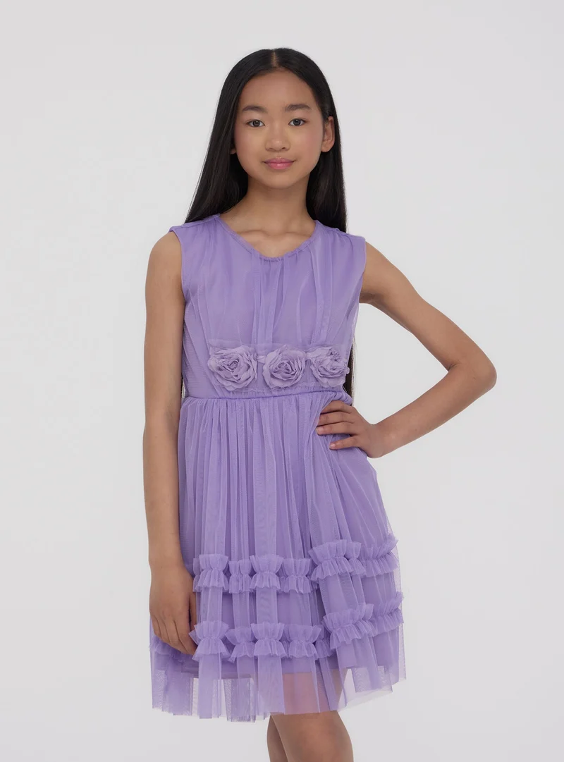 Vestito con balze e applicazioni floreali