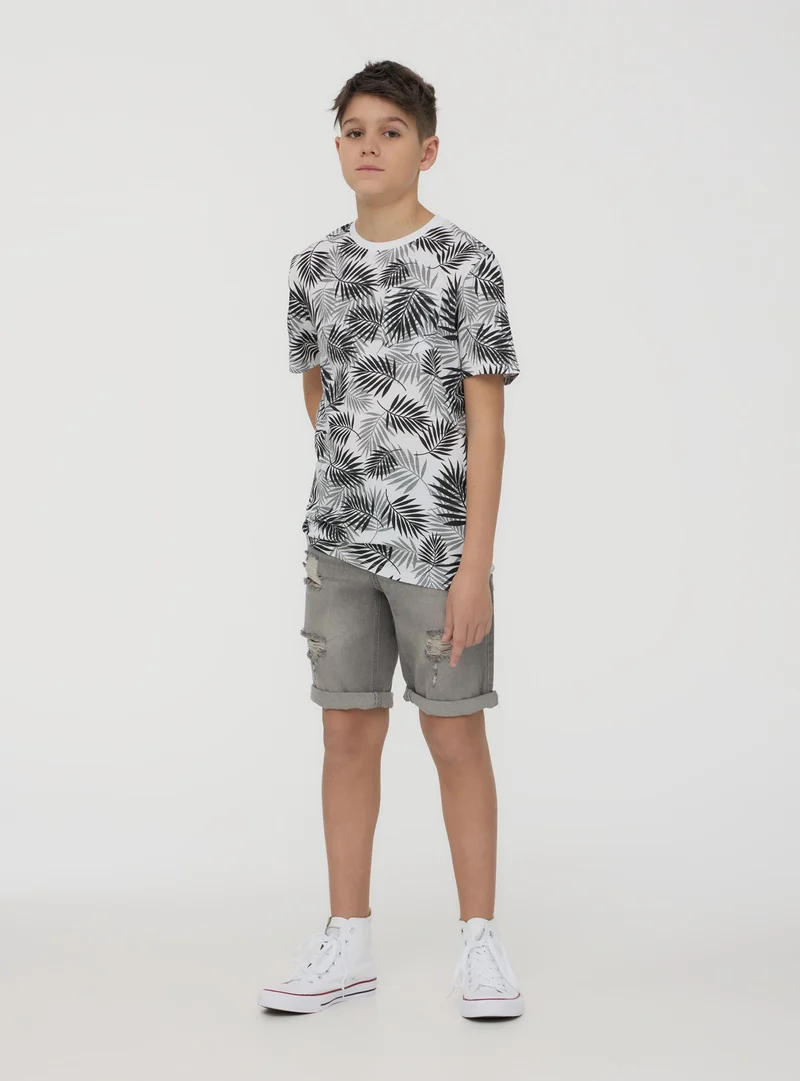 T-shirt con taschino fantasia foglie
