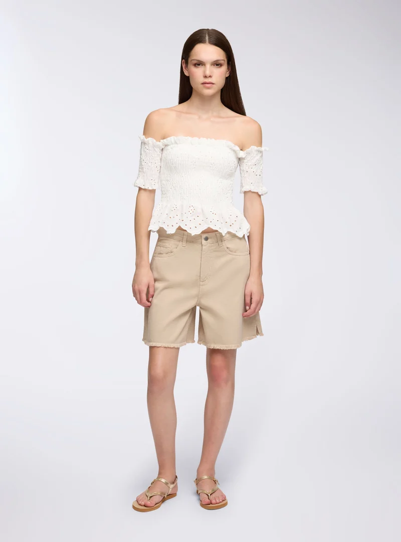 Shorts sfrangiati con spacchetti