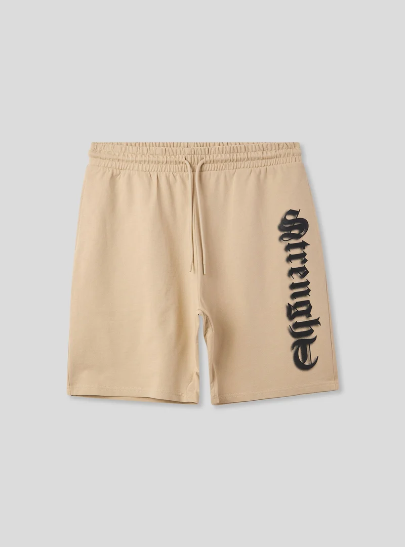 Bermuda tuta con scritta in stile gotico