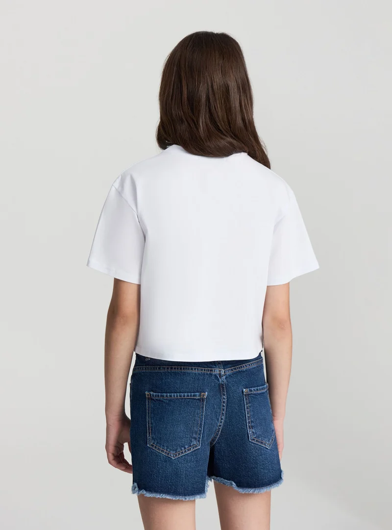 T-shirt con strass a cuore