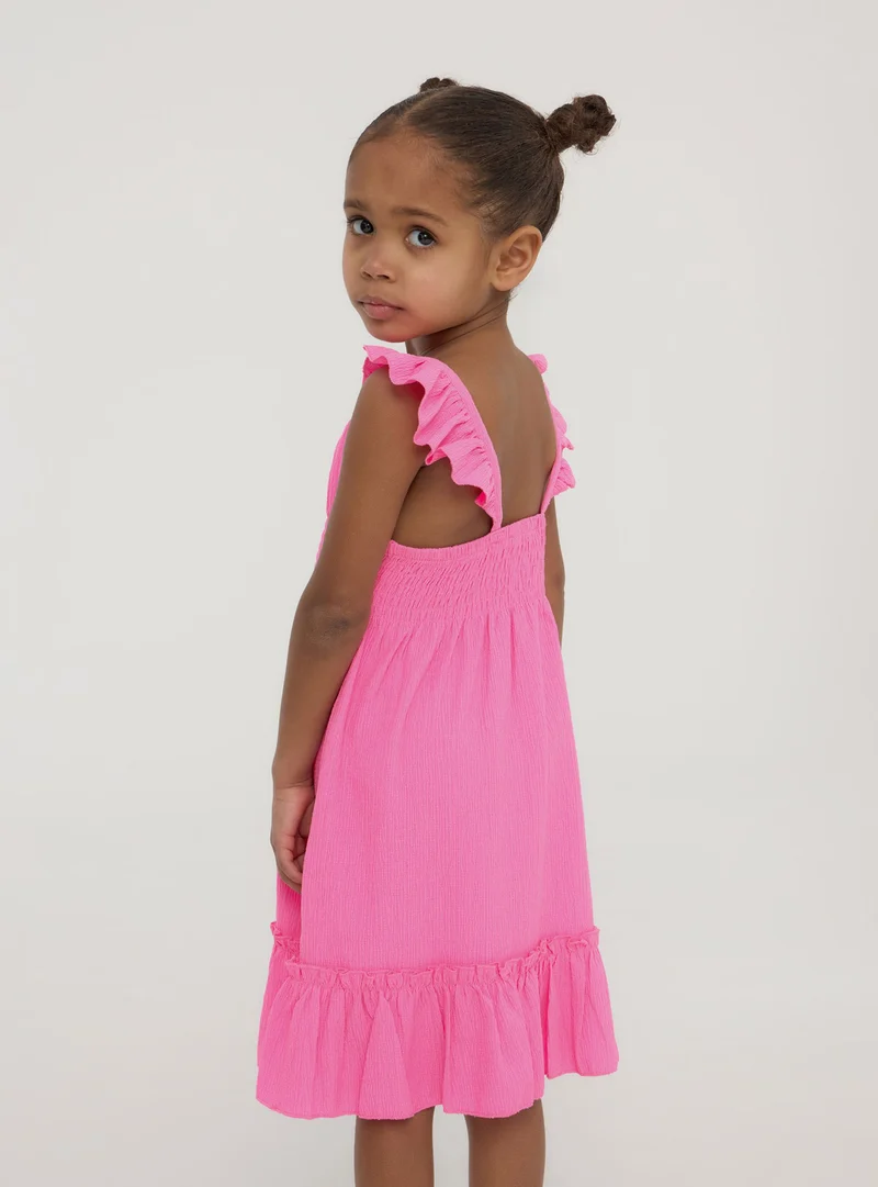 Vestito con arricciature e punto smock