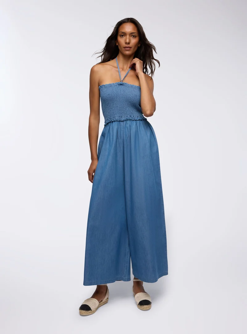 Tuta lunga chambray con punto smock