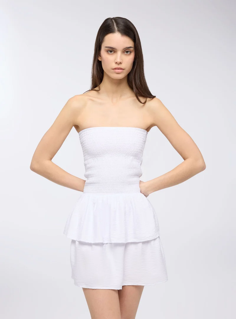 Vestito a fascia con punto smock e balze
