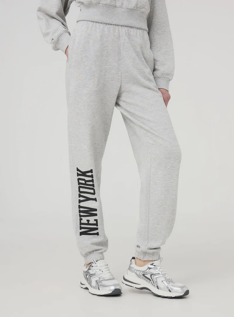 Pantaloni tuta leggeri a vita alta con scritta
