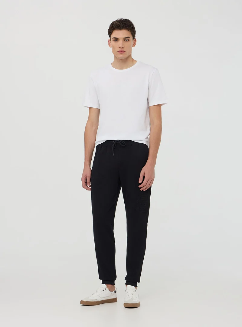Pantaloni tuta con scritta 3D