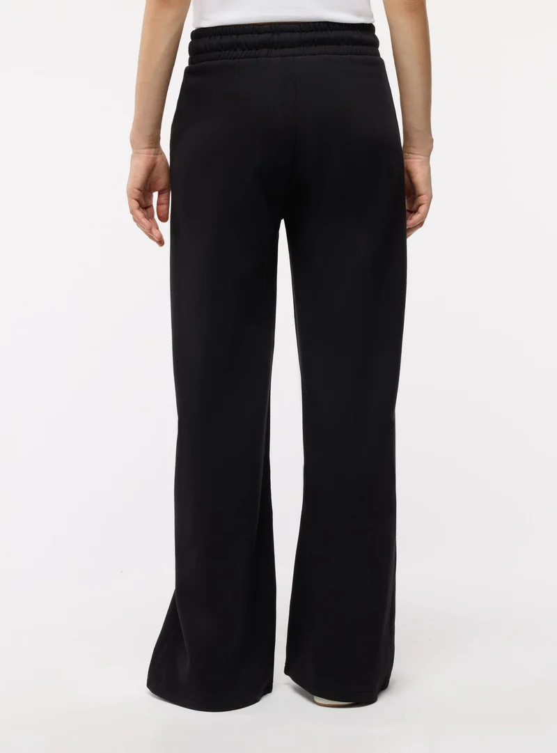 Pantaloni tuta wide leg tinta unita