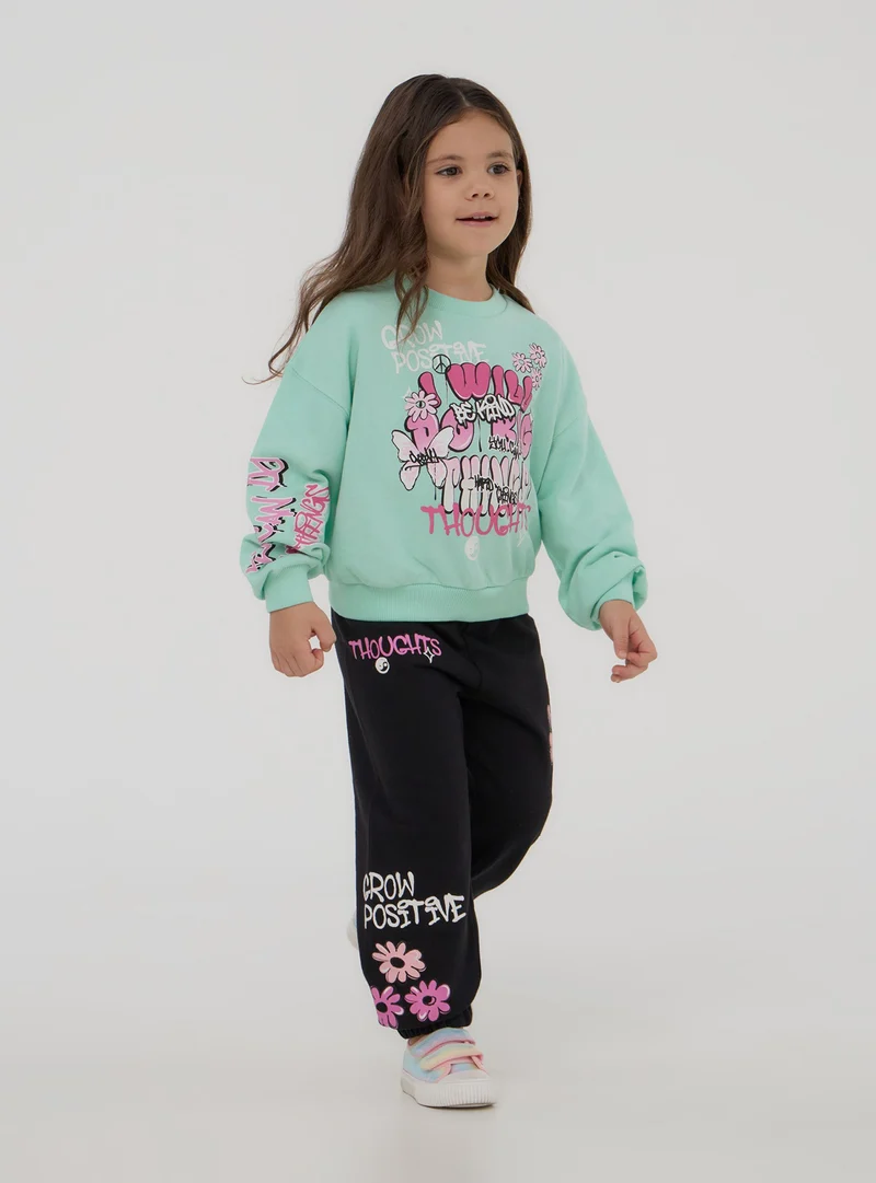 Pantaloni tuta con stampe stile graffiti