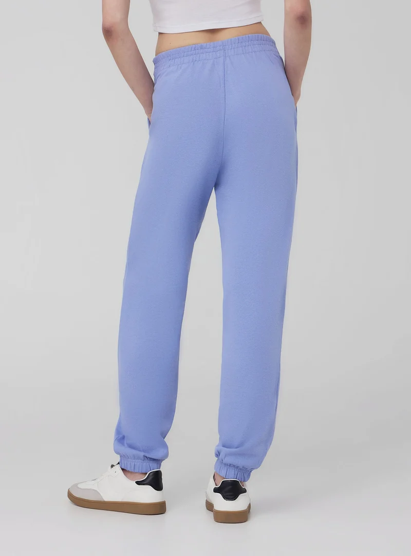 Pantaloni tuta leggeri a vita alta con scritta