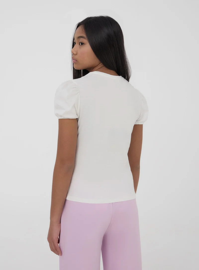 T-shirt con farfalla di paillettes