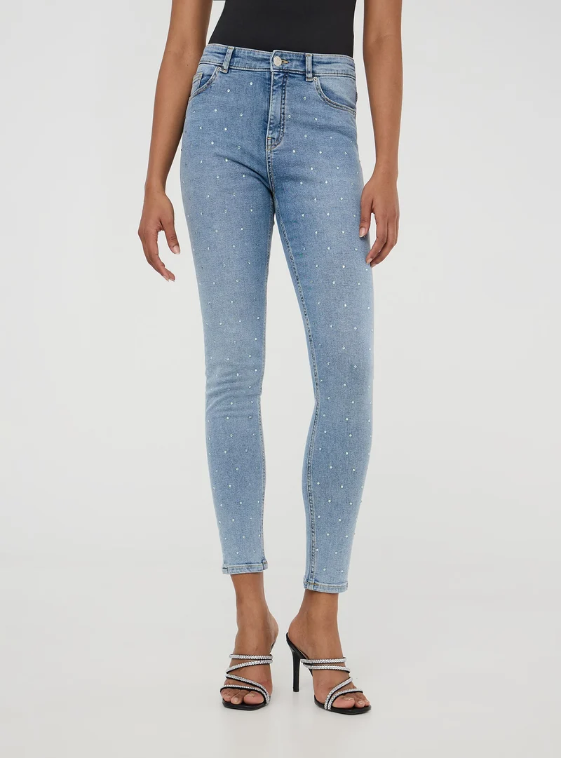 Jeans skinny con strass frontali