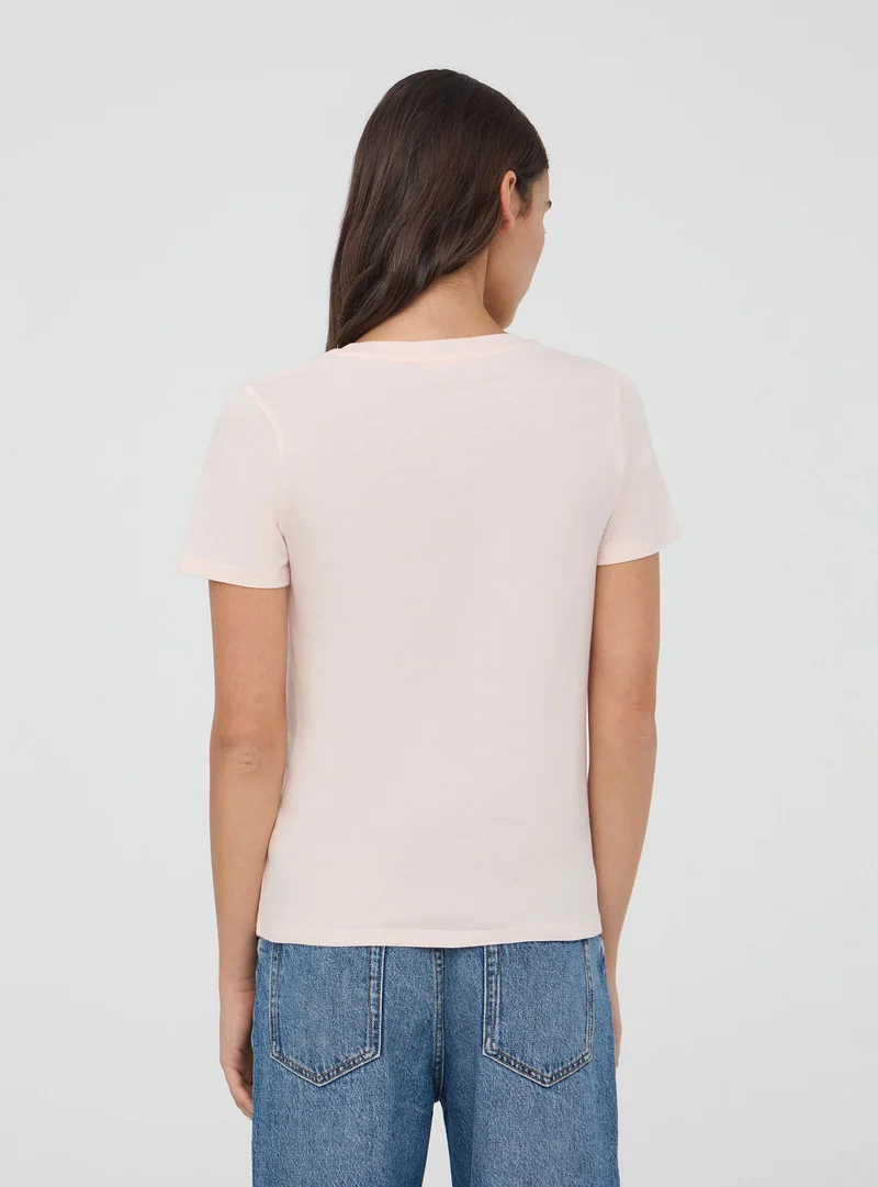 T-shirt con stampa laminata con cuore