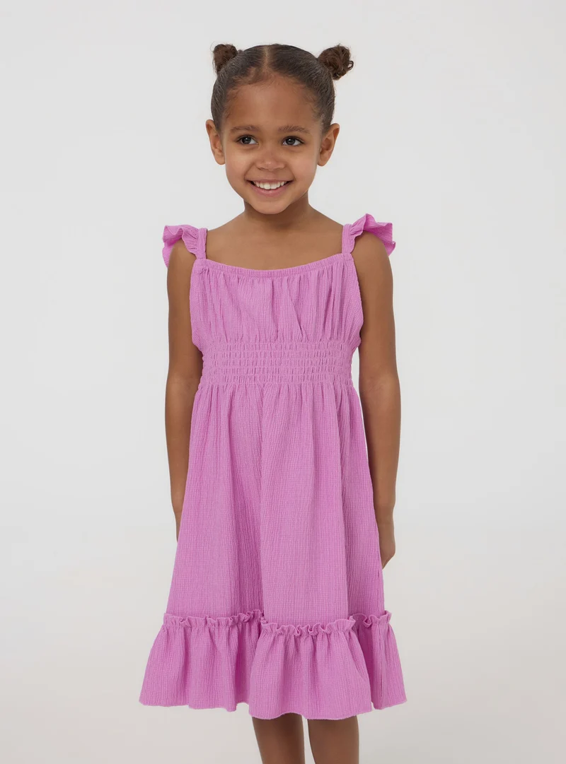 Vestito con arricciature e punto smock