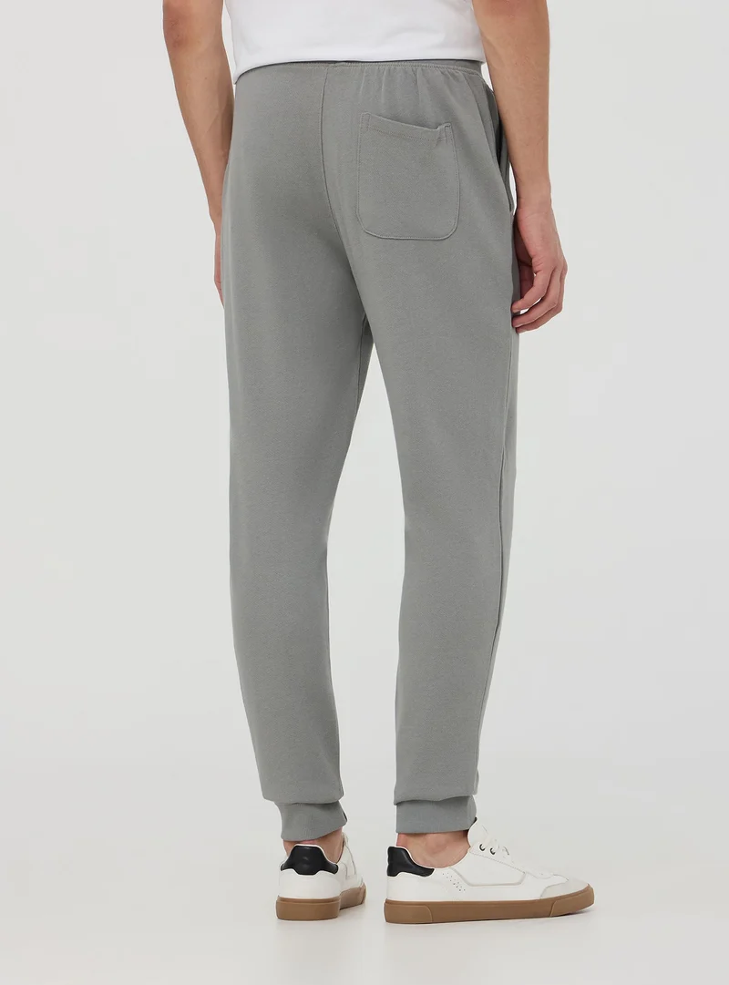 Pantaloni tuta con scritta 3D