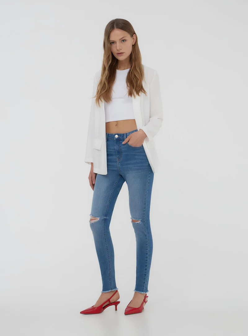 Jeans skinny con strappi