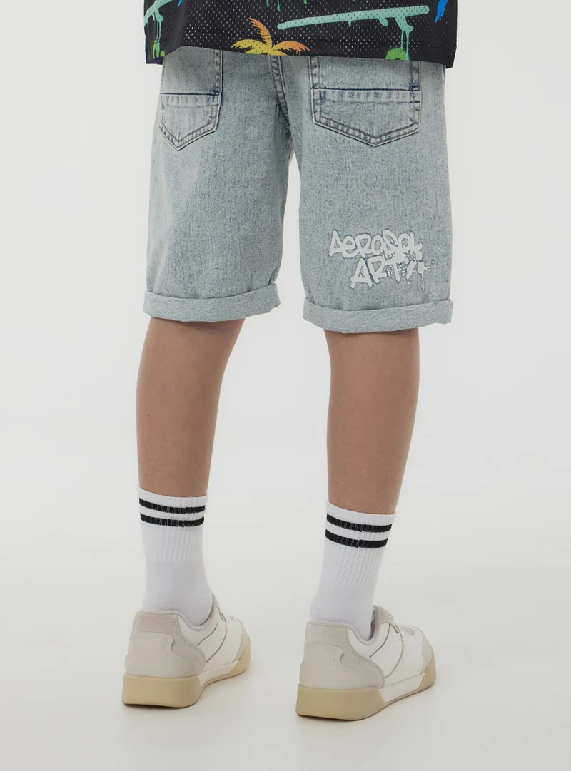 Pantaloncini in denim con scritta
