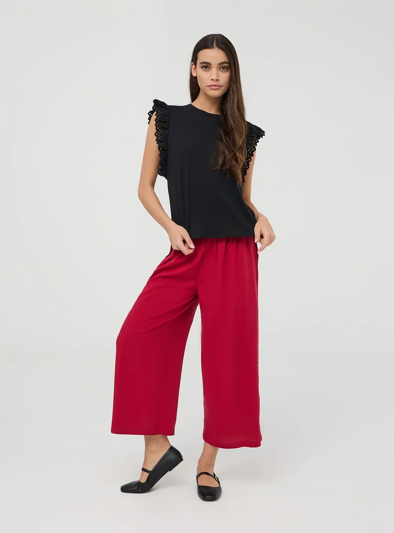 T-shirt con maniche ad aletta