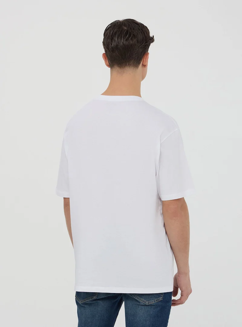 T-shirt oversize con stampa rose
