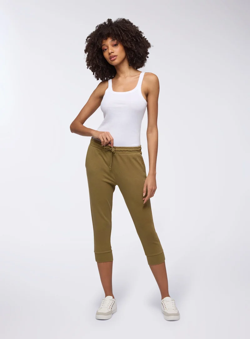 Pantaloni tuta pinocchietto con coulisse