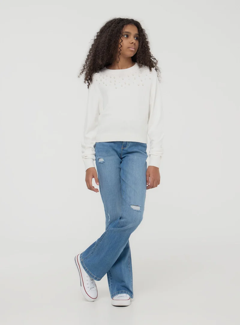Jeans a zampa con strappi