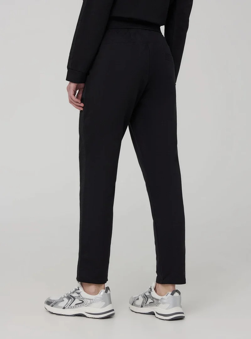 Pantaloni skinny effetto raso con banda laterale
