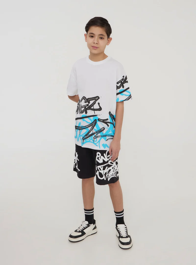 Pantaloncini tuta con stampa graffiti
