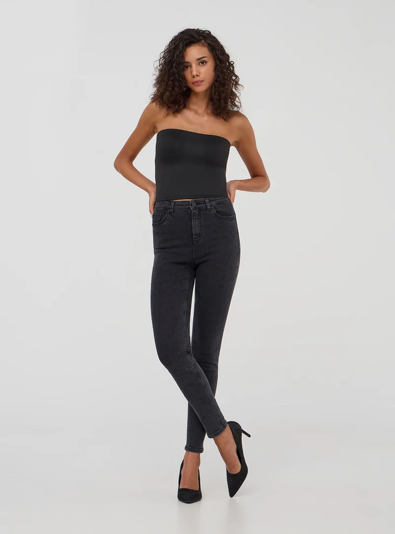 Jeans skinny con strass laterali