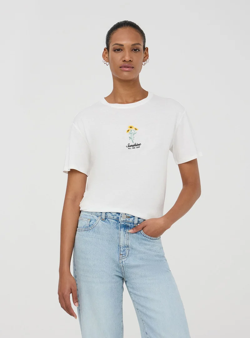 T-shirt ampia con ricamo fiore