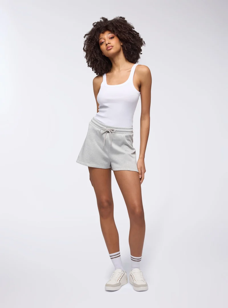 Pantaloncini tuta effetto luccicante