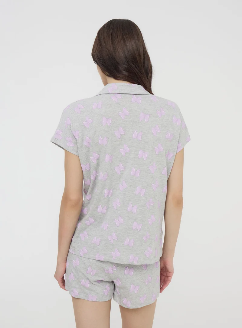 Set pigiama camicetta e shorts con fiocchi