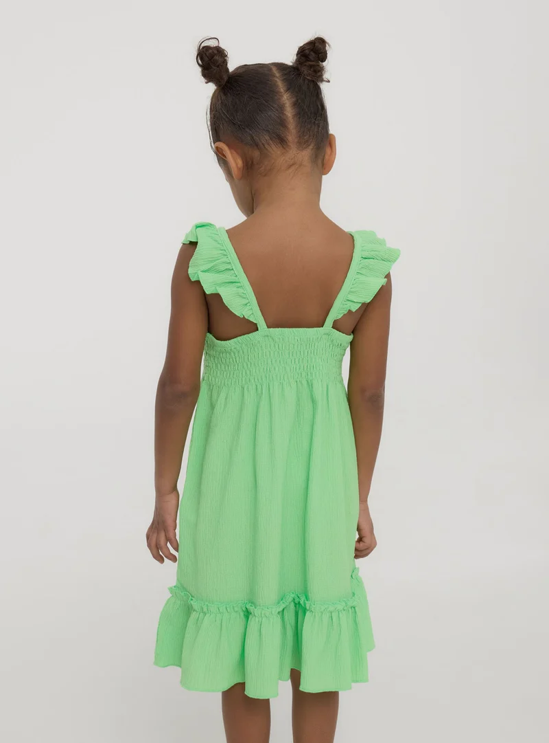 Vestito con arricciature e punto smock