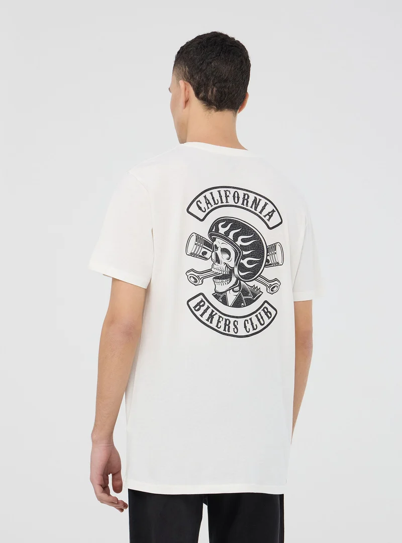 T-shirt con scritte e stampa teschio