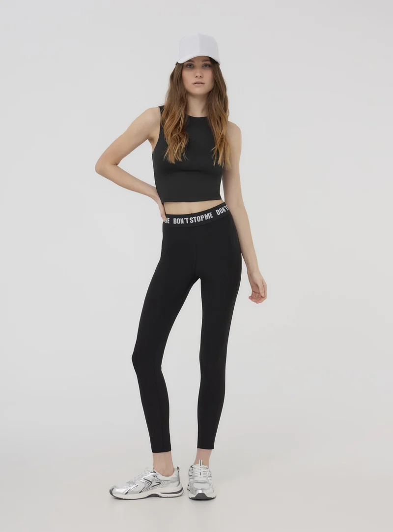 Leggings a vita alta con scritta e dettaglio semitrasparente