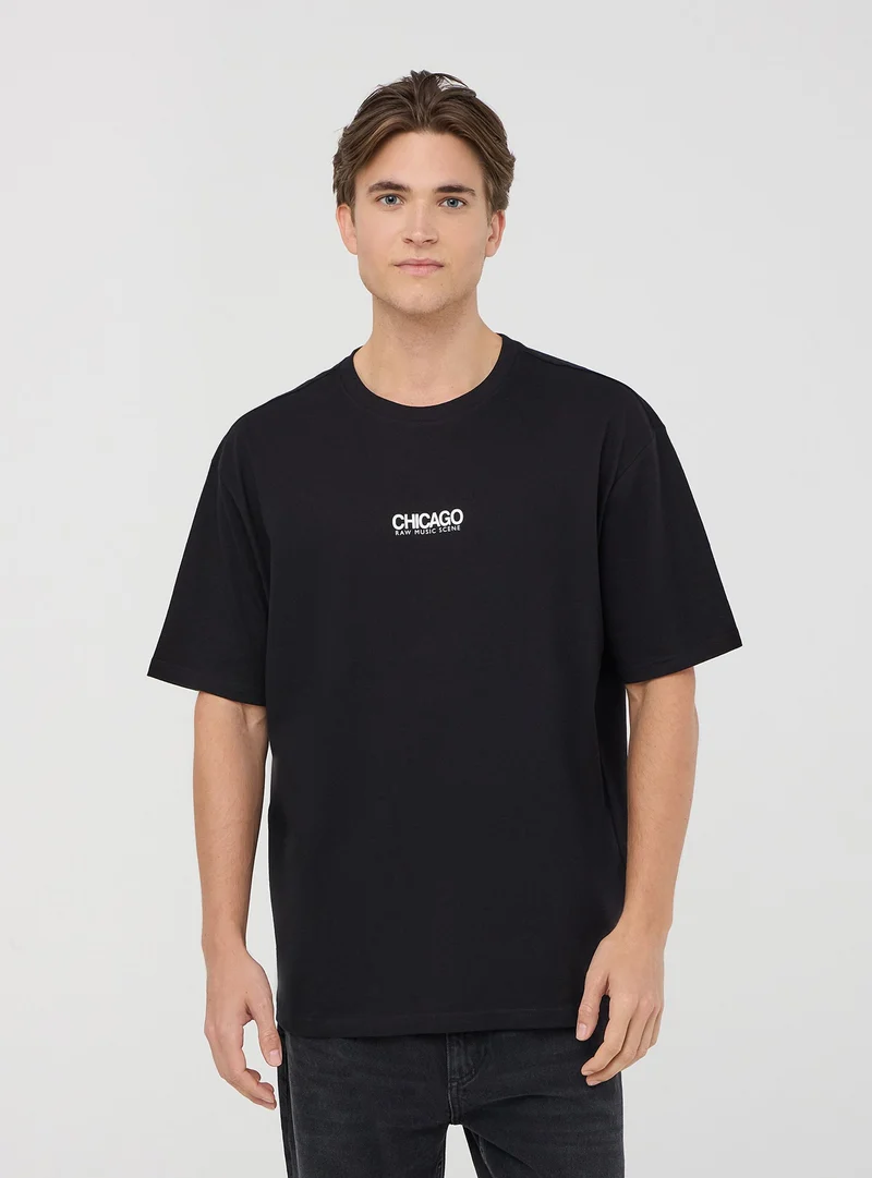 T-shirt over con scritte fronte/retro