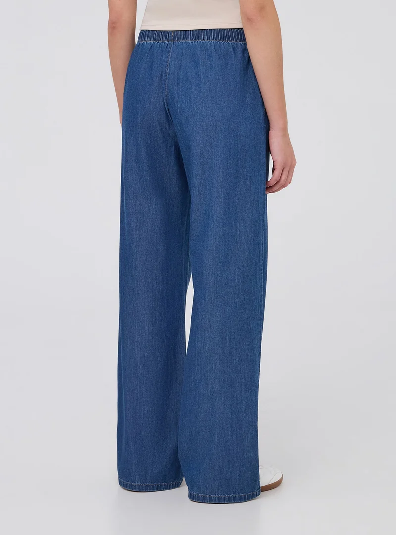 Jeans wide leg con elastico in vita