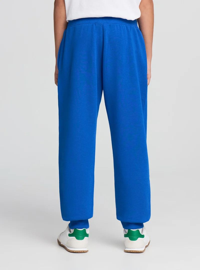 Pantaloni tuta con coulisse e stampa