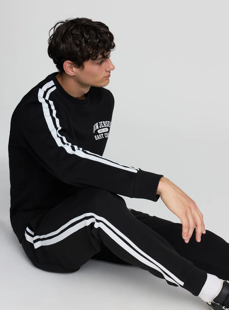 Pantaloni tuta con bande laterali