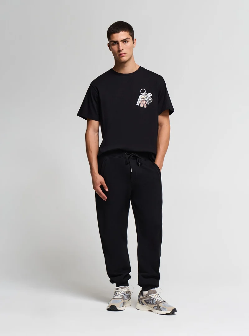 Pantaloni tuta con coulisse tinta unita