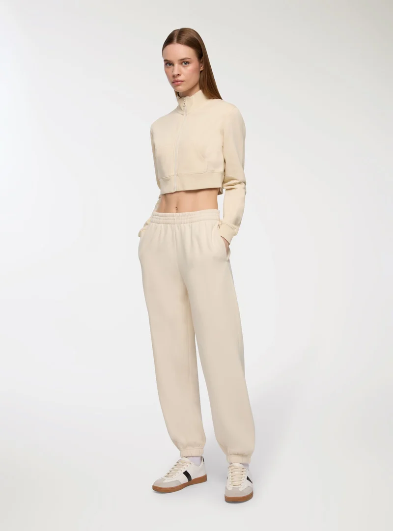 Pantaloni tuta vita alta con polsini