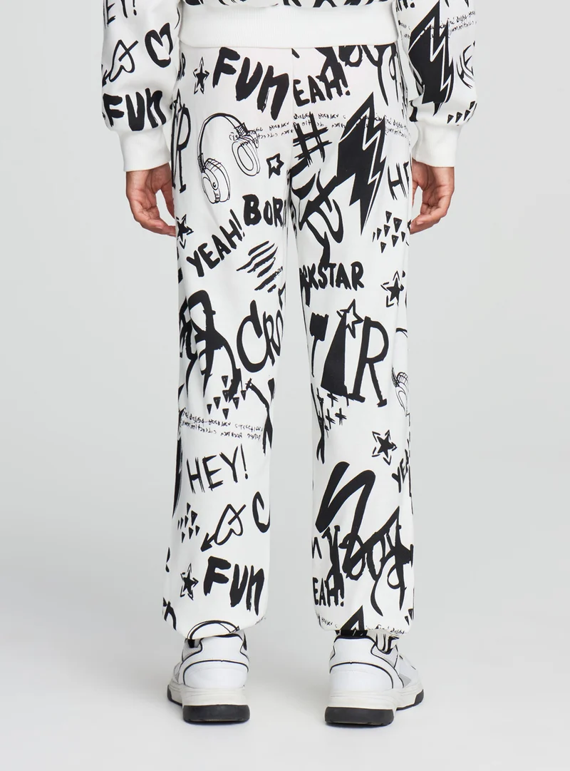 Pantaloni tuta con stampa graffiti