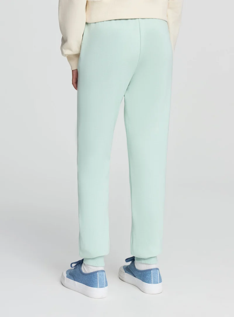 Pantaloni tuta tinta unita