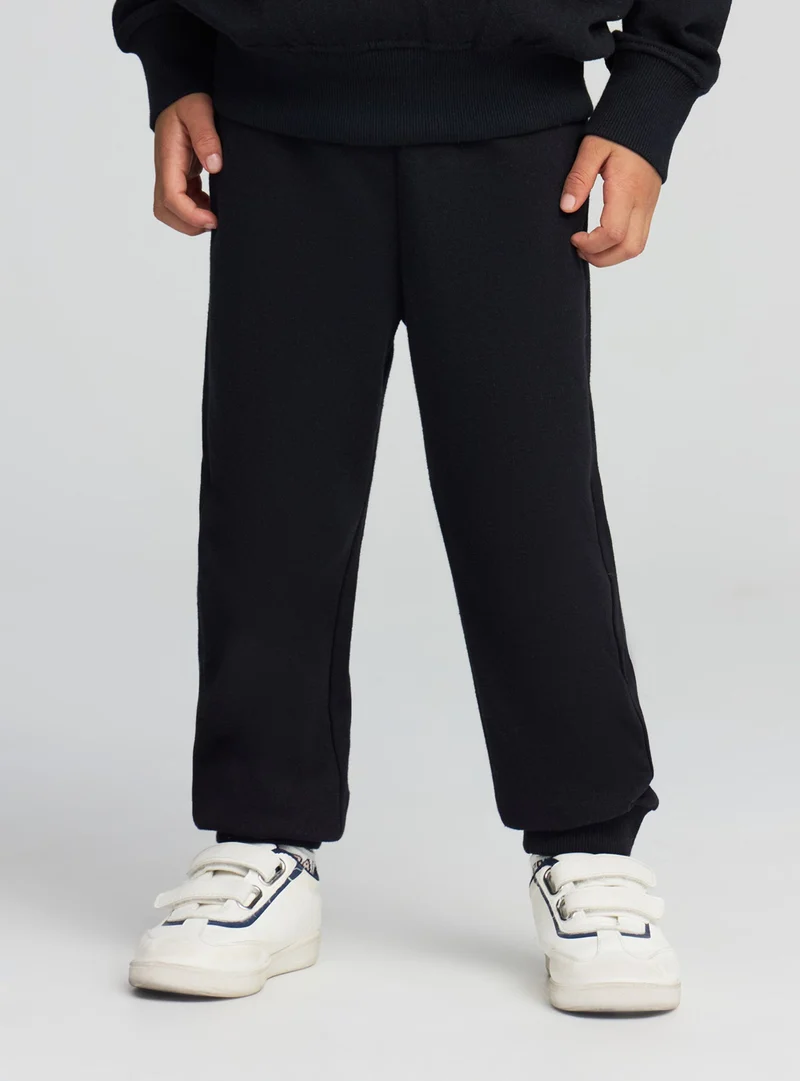 Pantaloni tuta leggeri tinta unita