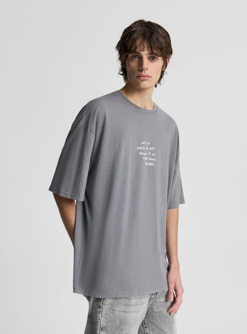 T-shirt oversize con scritta