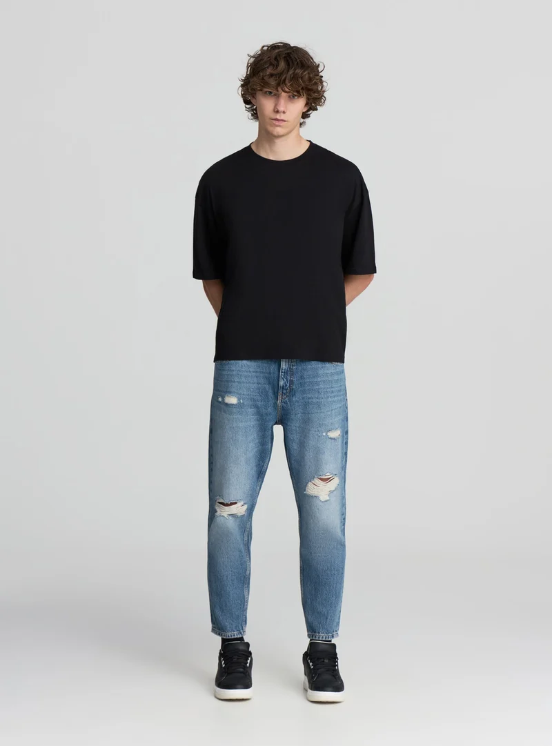 Jeans loose fit con strappi ampi