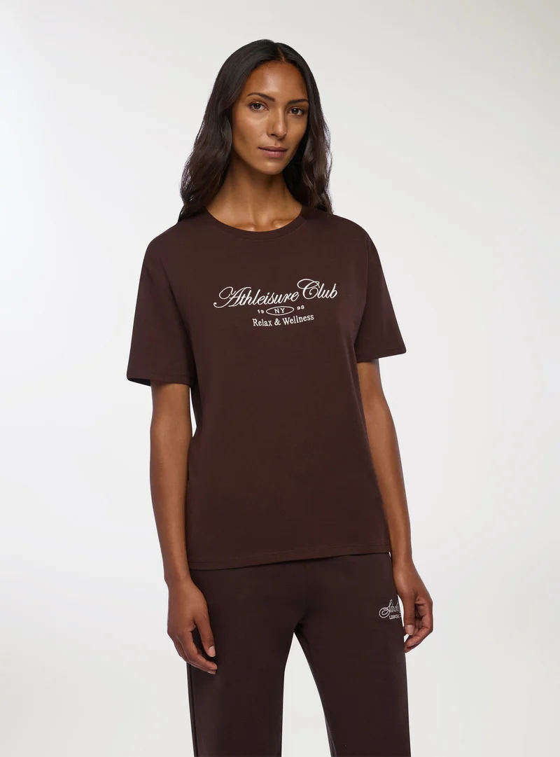 T-shirt ampia con scritta