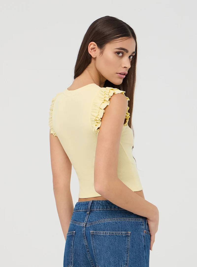 T-shirt crop con maniche a balze