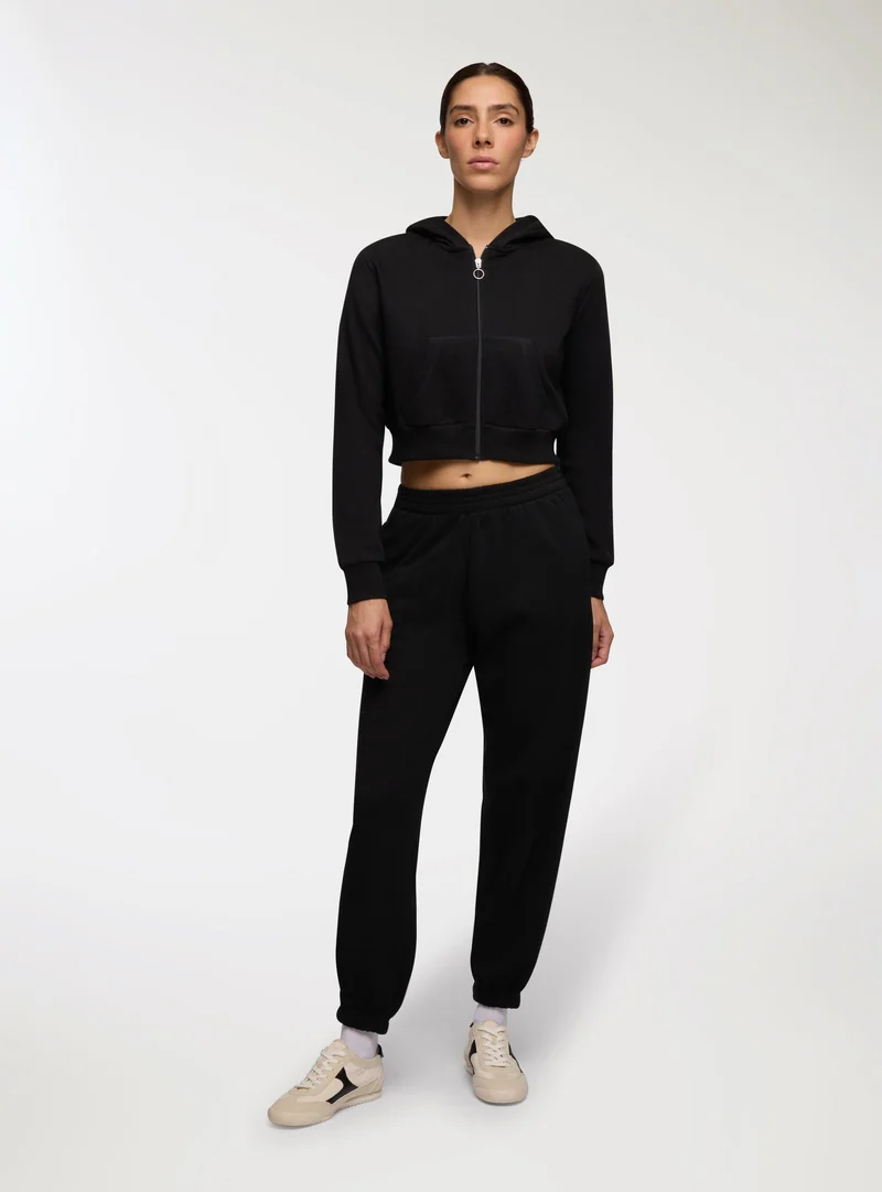 Pantaloni tuta vita alta con polsini