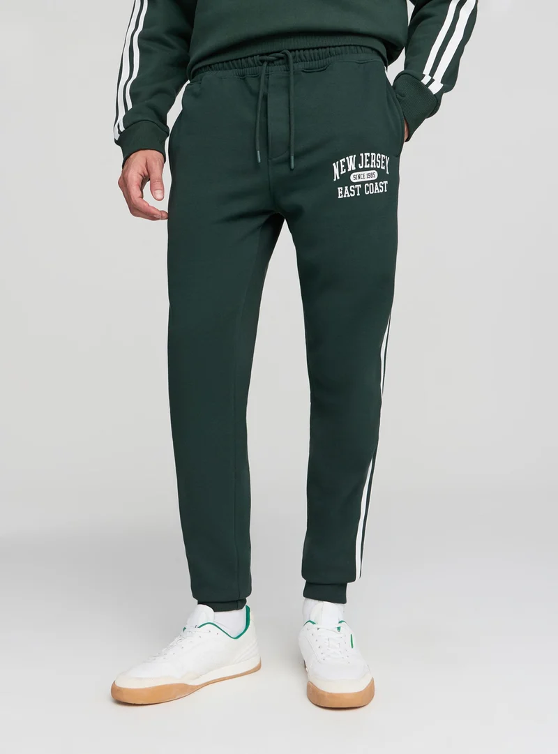 Pantaloni tuta con bande laterali