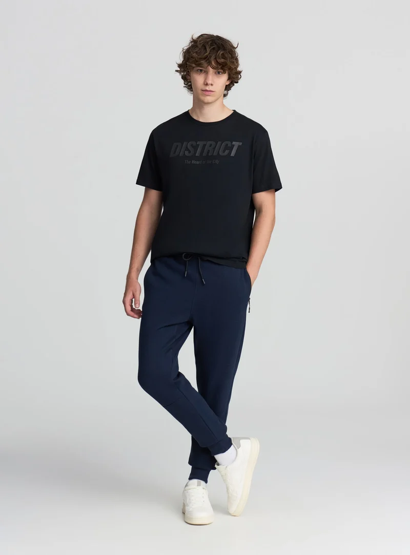 Pantaloni tecnici con tasche con zip
