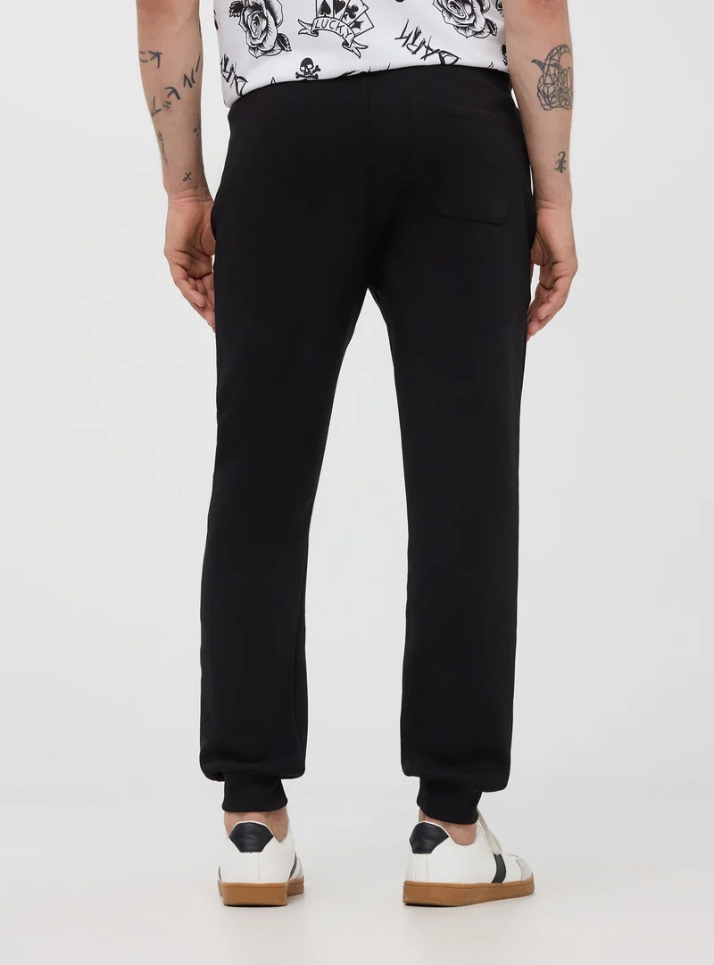 Pantaloni tuta pesanti con coulisse e polsini